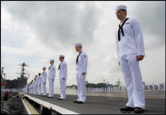 Sailors stand in formation as the USS George Washington (CVN-73) departs for its 2015 patrol. US Navy Photo